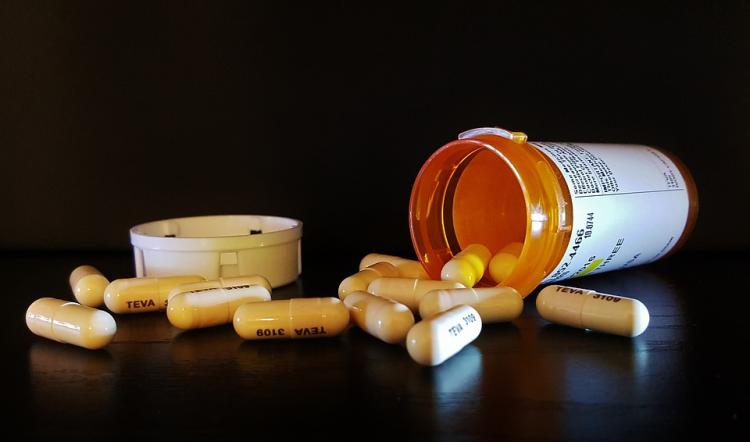 Prescription medication spilled out on table