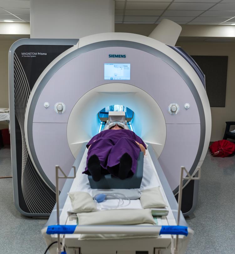 A person having her brain scanned