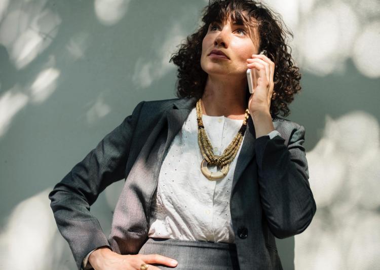 Professional woman talks on phone