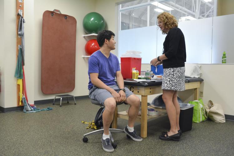 Students attend a free flu shot clinic at the CU Boulder Rec Center.