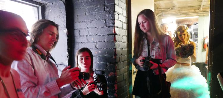 CU Boulder students compare students backstage during the Recycled Runway show