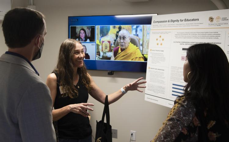 Researchers and community members chat during the Crown Institute's grand opening event