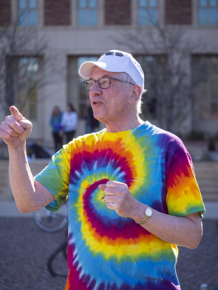 Tom Cech leads RNA splicing interpretive dance. Photo by Glenn Asakawa.
