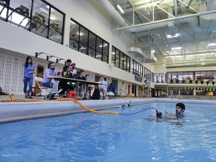 The RoboSub team researching their project at CU Boulder's Rec Center.