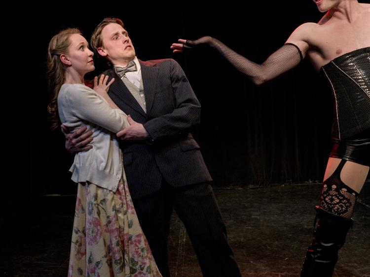 The cast of The Rocky Horror Show poses on stage