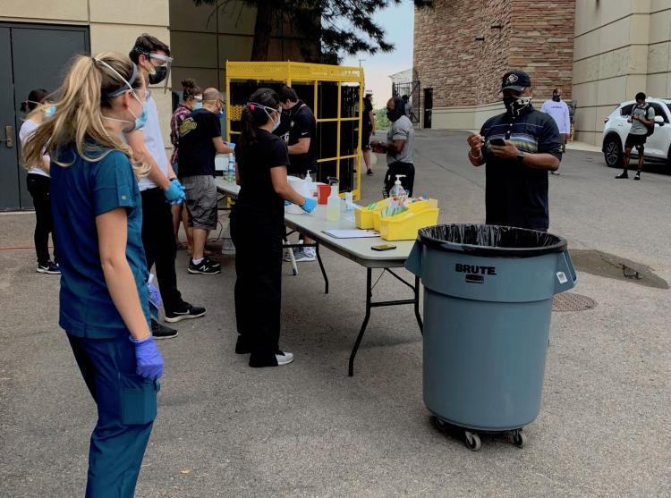 A mobile testing lab set up in a parking lot.