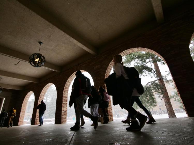 Students walk past the UMC