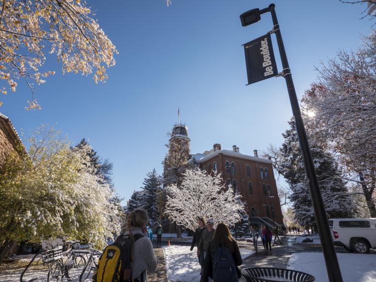 Students walk on snowy campus