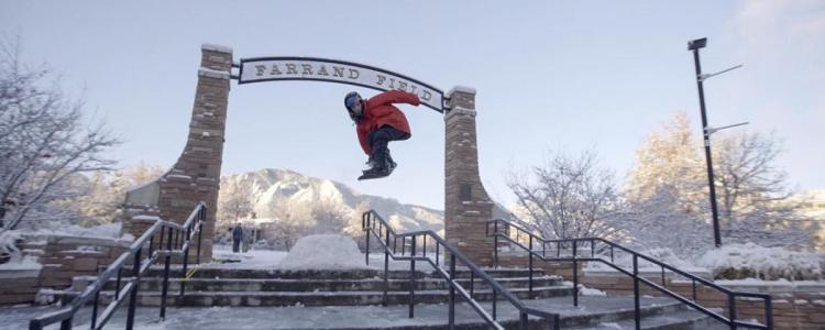 Student snowboarding at Farrand Field