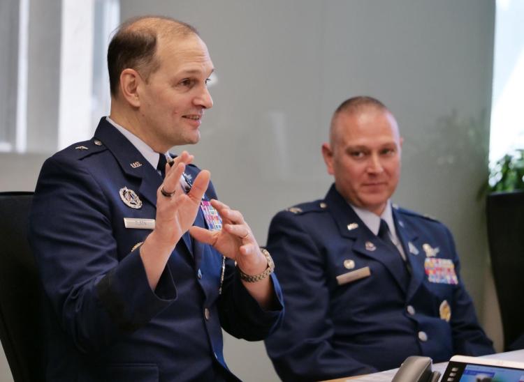 Brig. Gen. John Olson, left, and Col. Marc Brock talk with Colorado leaders on the CU Boulder campus