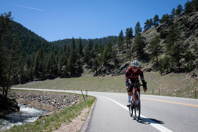 Flora Duffy rides through Lefthand Canyon near Boulder while training.