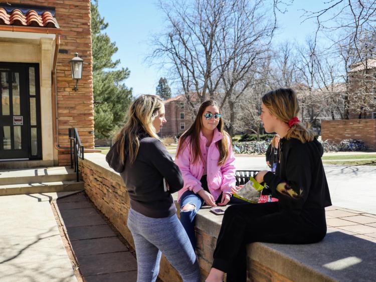 Students chat on campus