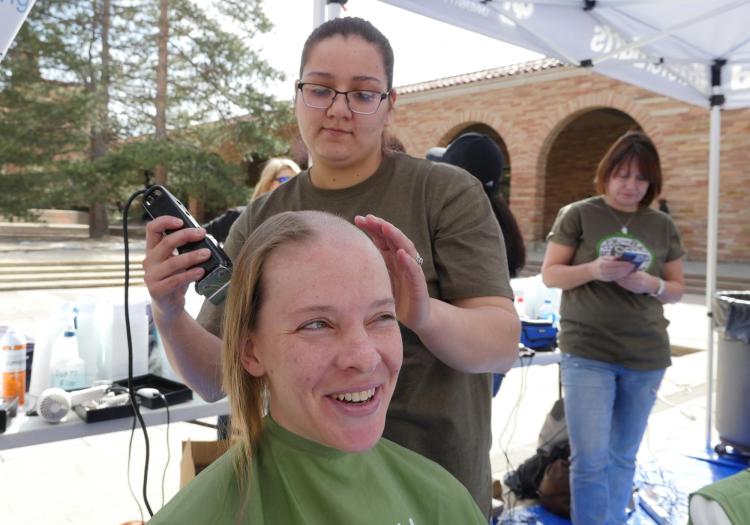 First-year ENVD student Nicole Elder donates her hair. Photo by Casey A. Cass.