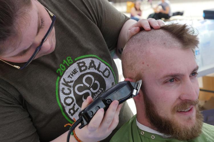 Tim Lyons from Arvada donates his hair. Photo by Casey A. Cass.