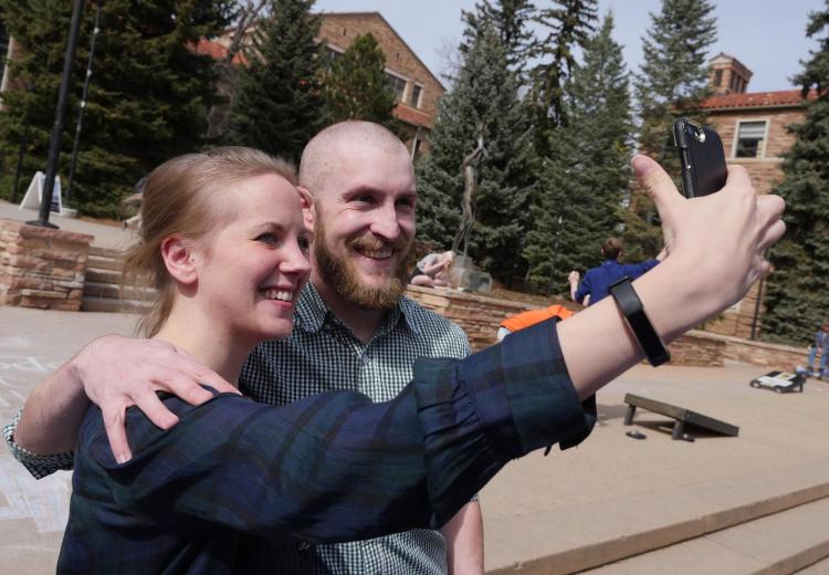 Tim Lyons poses for a selfie post-shave with his wife Dana, who works in Admissions. Photo by Casey A. Cass.