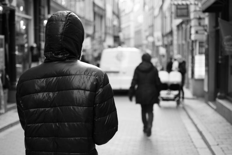 Person following someone else on street