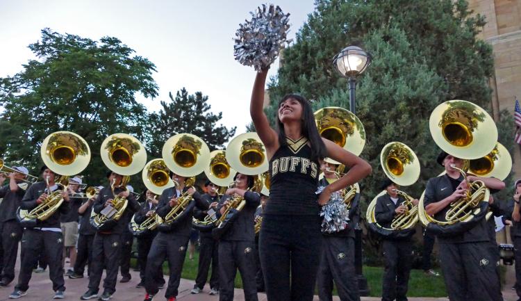 CU Boulder homecoming Stampede with marching band downtown
