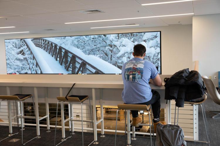 Students at the Leeds School of Business practice safe protocols while studying indoors.
