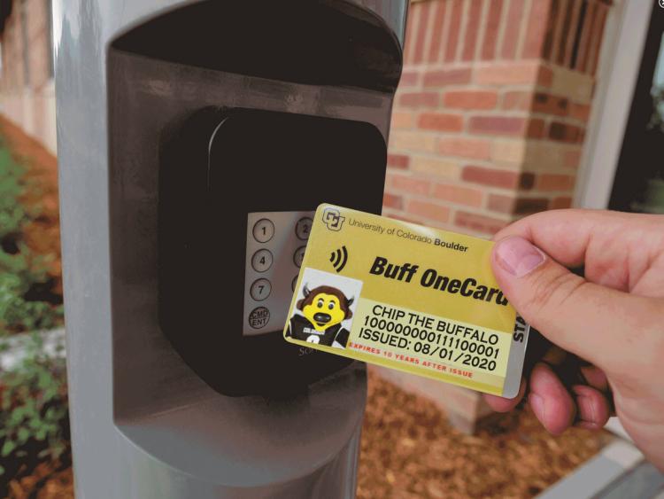Person tapping their Buff OneCard for building access