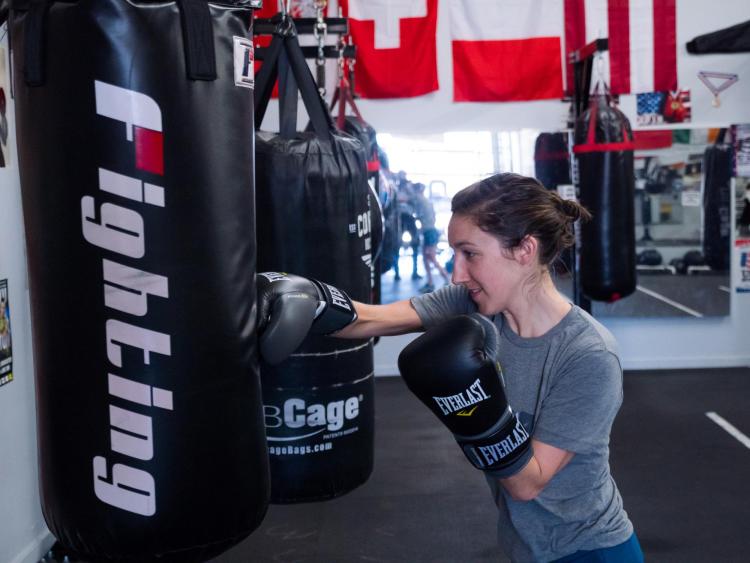 Tessie Dawson takes a swing at a punching bag