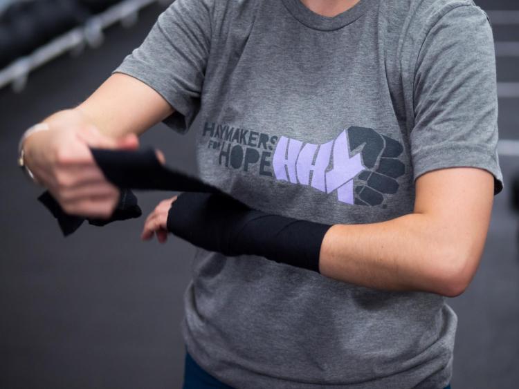 Tessie Dawson puts on her boxing hand wrap