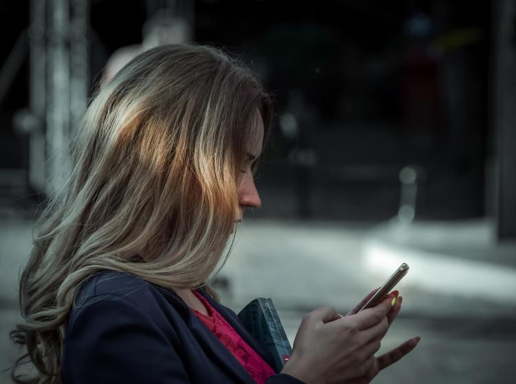 Woman texting on cell phone