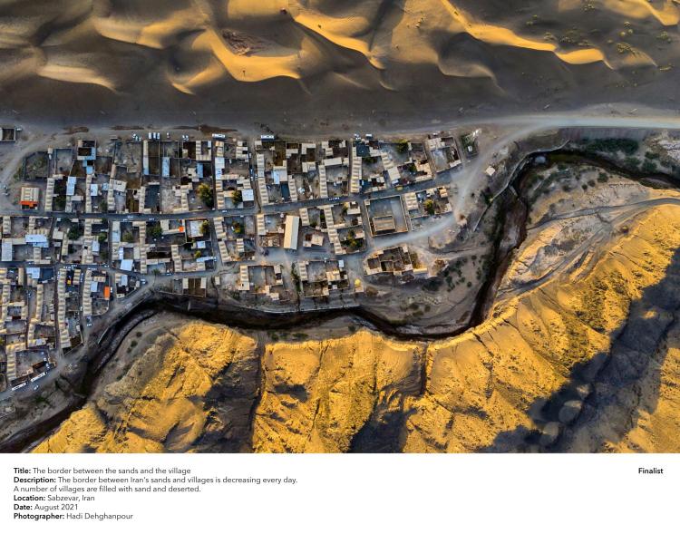 The decreasing border between Iran's sands and villages.