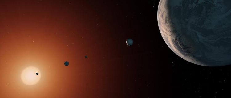 Illustration of five planets with a star in the background