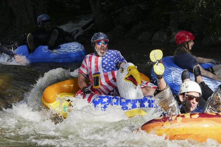 Tubers ride the Boulder Creek for Tube to Work Day 2018