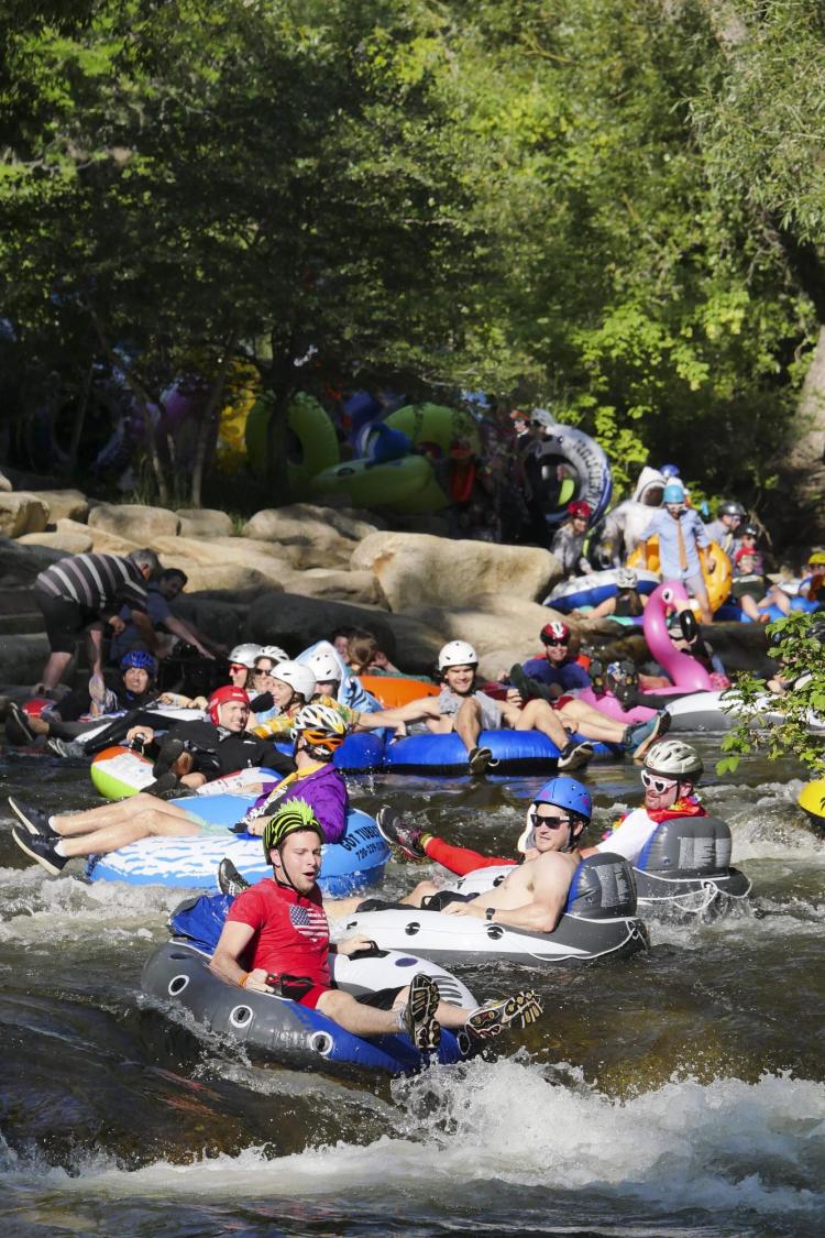 Tubers ride the Boulder Creek for Tube to Work Day 2018