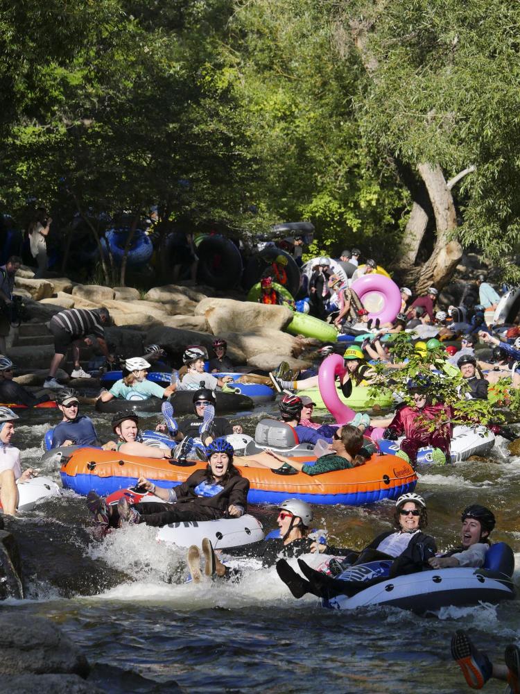 Tubers ride the Boulder Creek for Tube to Work Day 2018