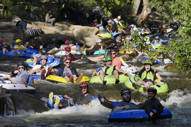 Tubers ride the Boulder Creek for Tube to Work Day 2018
