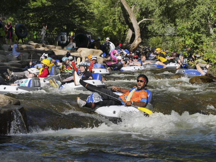 Tubers ride the Boulder Creek for Tube to Work Day 2018