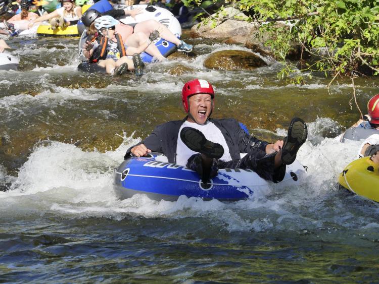 Tubers ride the Boulder Creek for Tube to Work Day 2018