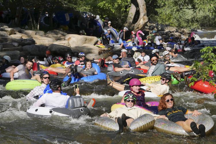 Tubers ride the Boulder Creek for Tube to Work Day 2018