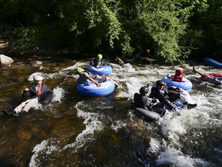 Tubers ride the Boulder Creek for Tube to Work Day 2018