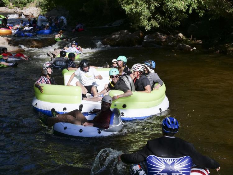 Tubers ride the Boulder Creek for Tube to Work Day 2018