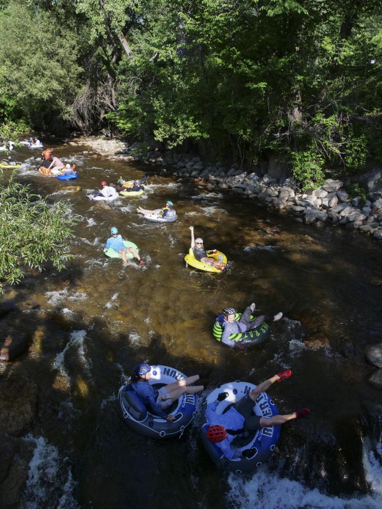 Tubers ride the Boulder Creek for Tube to Work Day 2018