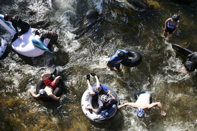 Tubers ride the Boulder Creek for Tube to Work Day 2018