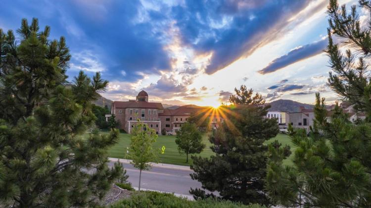 Sun peeking over campus views