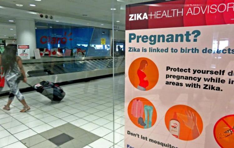 A sign warning pregnant women about the risk of birth defects posed by Zika.