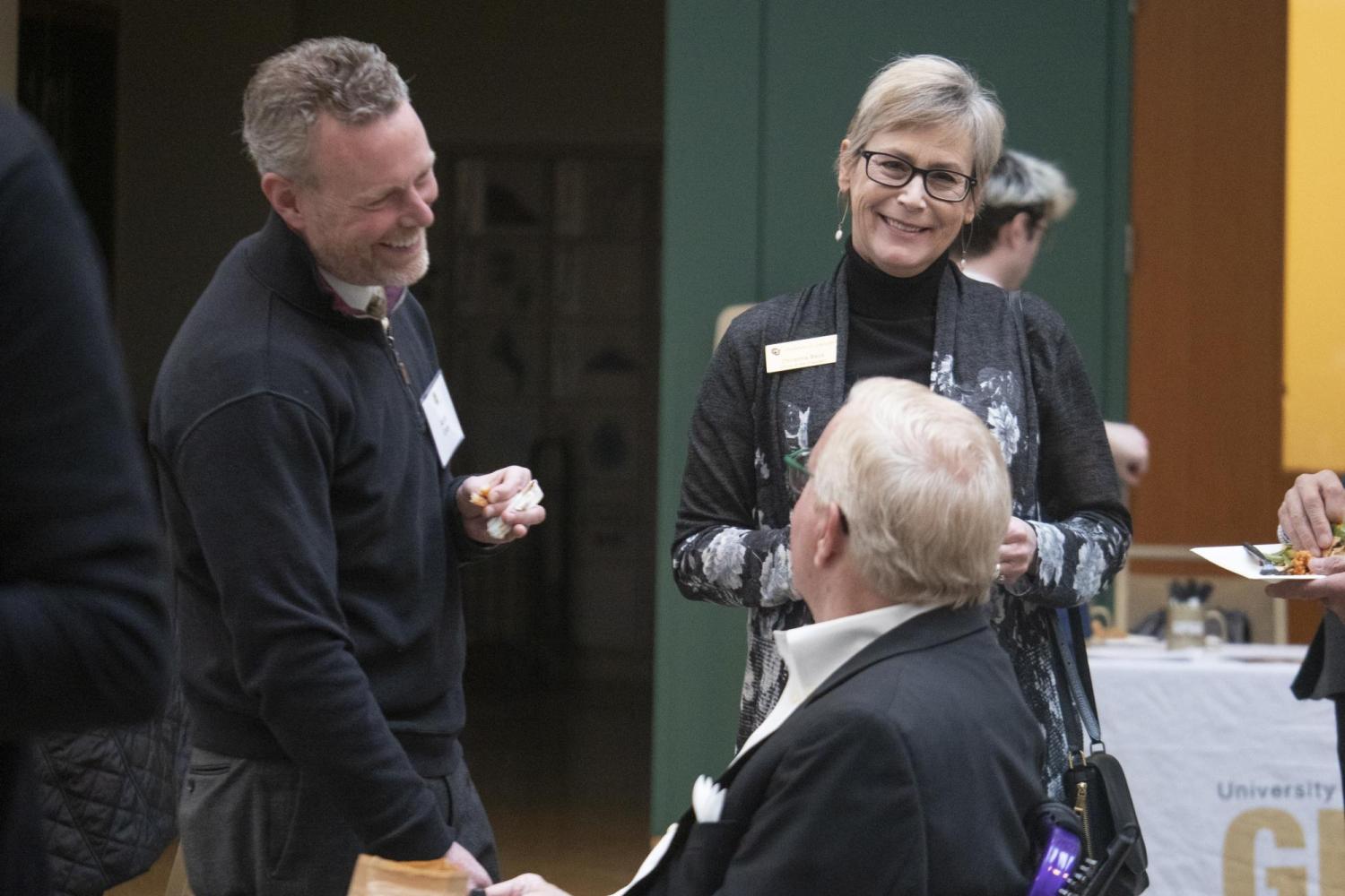 Apple executive Aaron Grider and CU system's Christina Beck chat with Chris Bentley