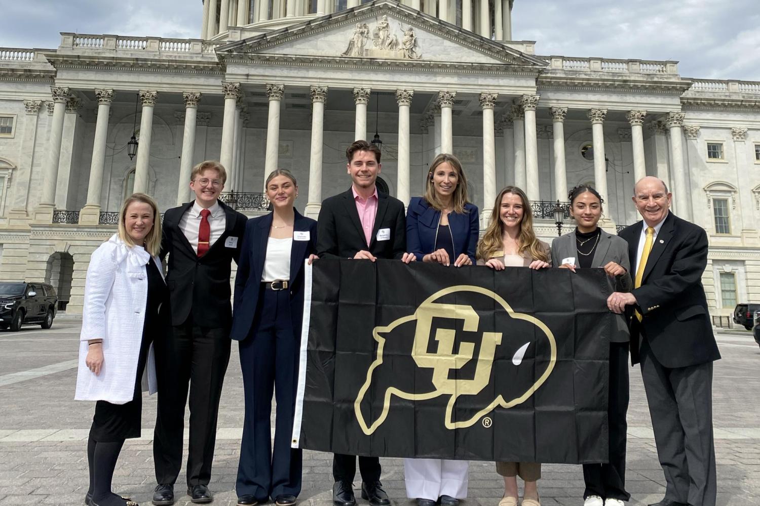 Chancellor, Stefanie Johnson and student leaders in front of the capitol building