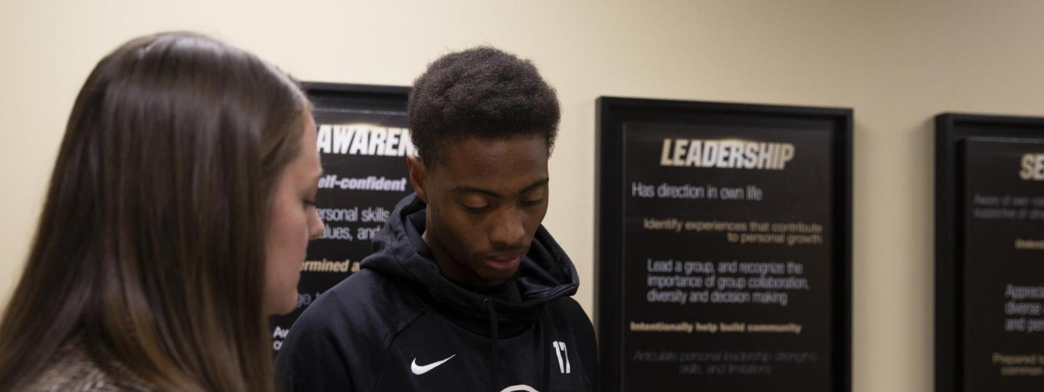 CU student-athlete Kabion Ento working with a mentor 