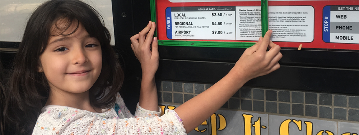A Whittier Elementary School student uses a green frame to show that she likes the sign being low enough for children to read it. Students used green and red frames to frame the things they liked and didn’t like about the HOP.