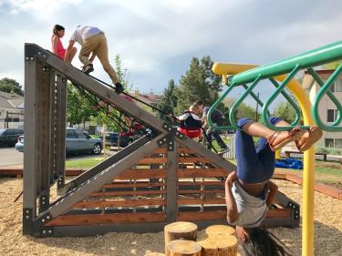 children play at new Kendall Apartments playground