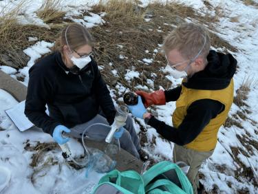 Researchers conduct water sampling.