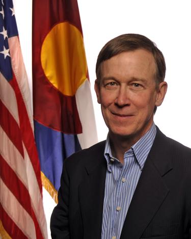 Governor Hickenlooper with a Colorado flag