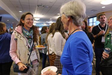 Conference attendees catch up with each other