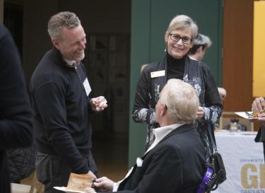 Apple executive Aaron Grider and CU system's Christina Beck chat with Chris Bentley